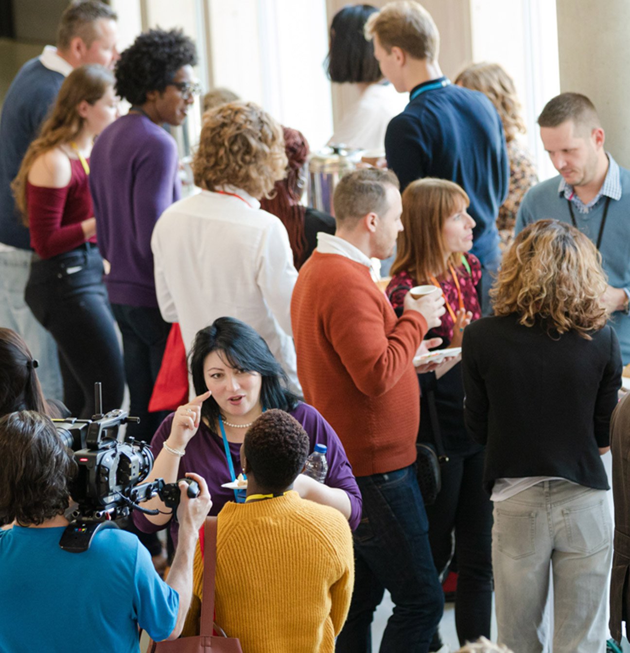 conference attendees conversating in hallway